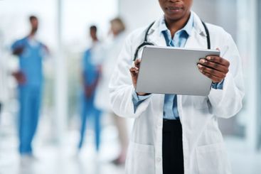 Healthcare, technology and hands of doctor with tablet...