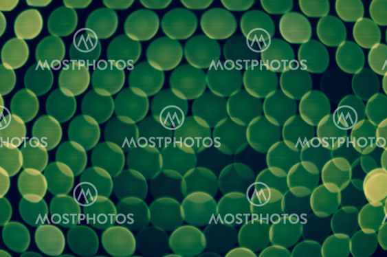 Lot of green blurred lights layered one another