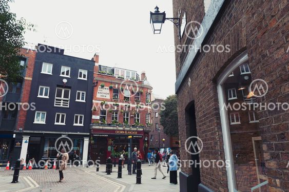 London, UK - April 2018: Corner of Neal Street seen from the end of Earlham Street along with historic buildings that house retail stores and restaurants between Soho and Covent Garden in central London
