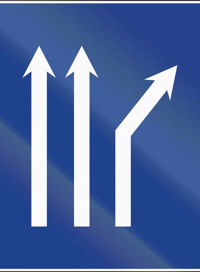 Road sign used in Spain - Fork right on three-lane...