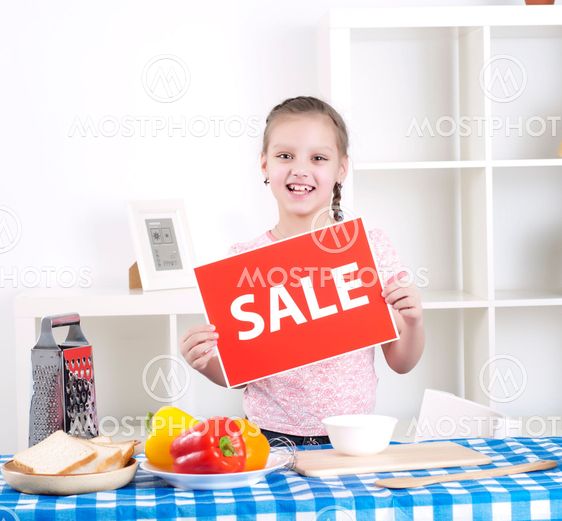 girl holding sale sign