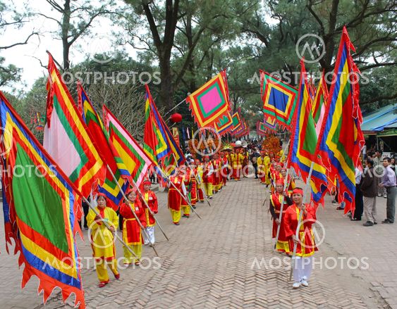 Group of people in traditional costume give gifts to the...
