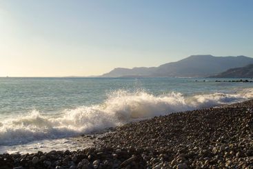 sea with the coastline in the background, Liguria, Italy