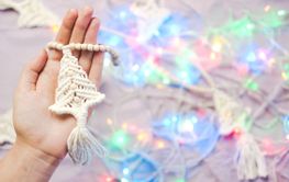Handmade crochet new year decoration in woman hands....