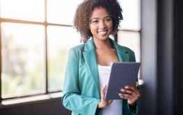 Professional woman engaged in work with a tablet in a...