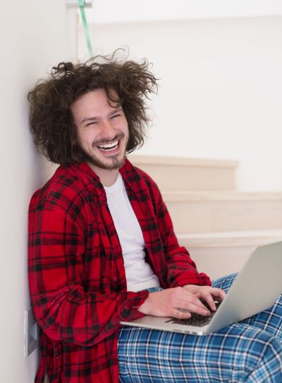 freelancer in bathrobe working from home