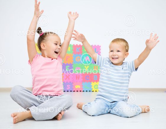 Children are sitting on floor