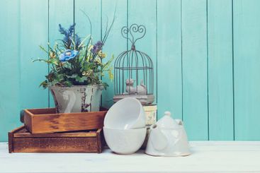 Shabby chic style home decorations on wooden background