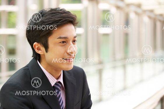 Portrait Of Chinese Businessman Outside Office