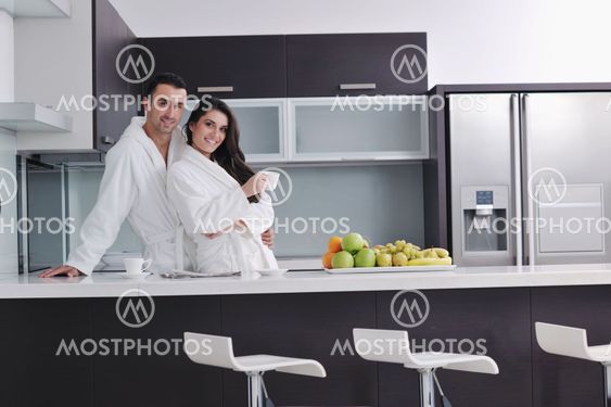young couple have fun in modern kitchen