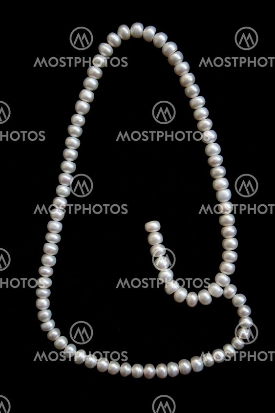 White pearls on the black velvet