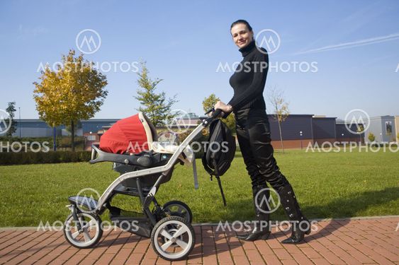 woman with pushing a pram