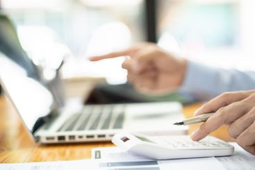 Business man working by using laptop computer Hands...