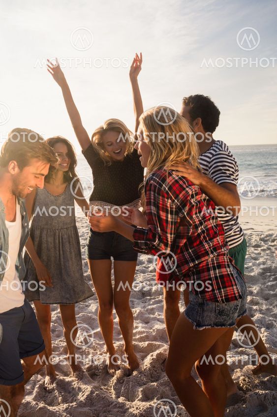 Happy friends dancing together