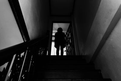 Girl standing on ladder in house with fear,child abuse...