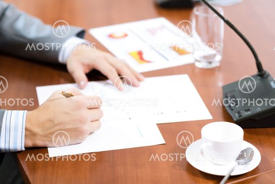 Businessman writing on paper notes