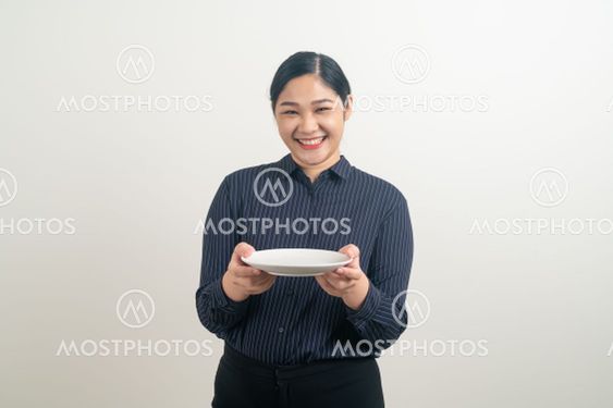 Asian woman with empty plate on hand