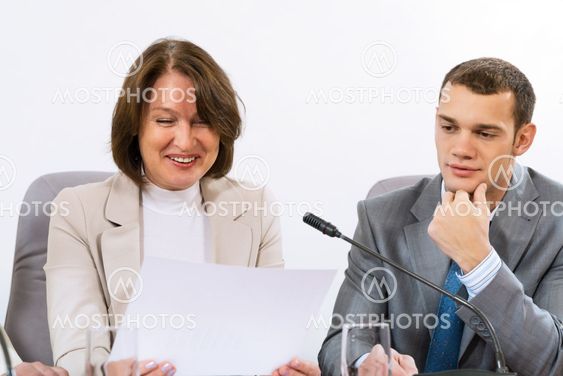 group of business people discussing documents