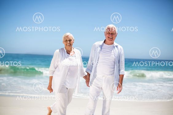 Senior couple holding hands