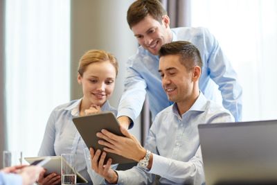smiling business people meeting in office