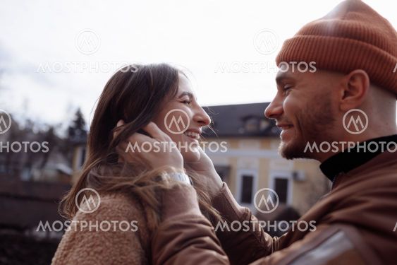 in love stylish young couple kissing in the city....
