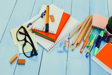 Workspace arrangement with stationery and supplies on a...