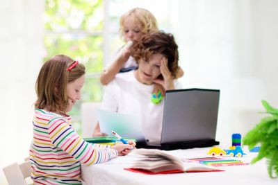 Mother working from home with kids. Quarantine.