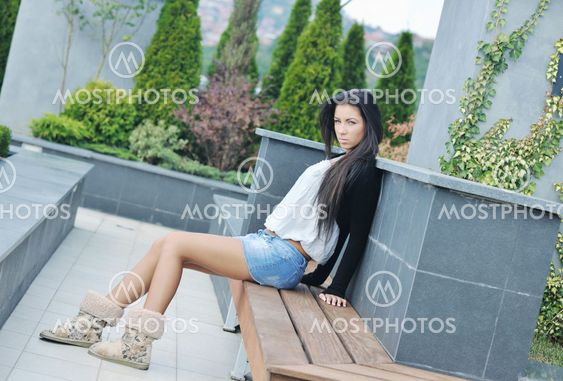 beautiful young lady posing in garden