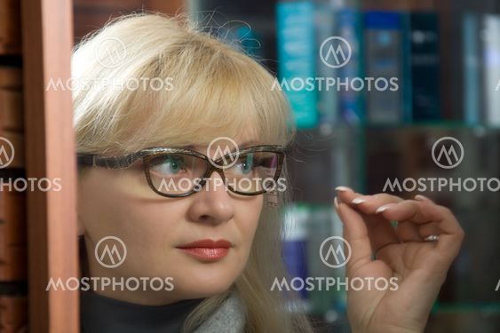 woman trying on glasses