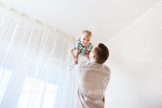 father with son playing and having fun at home