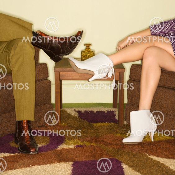 Couple's legs in boots.