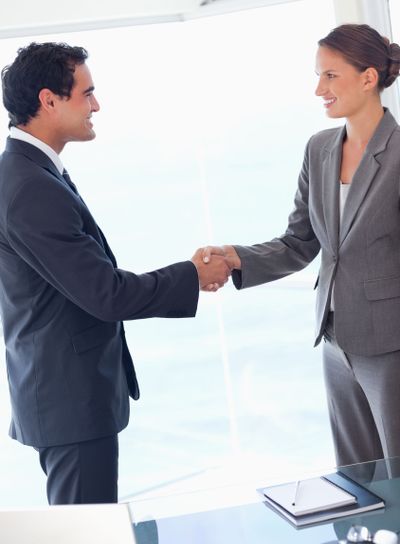 Side view of business partner agreeing on a deal