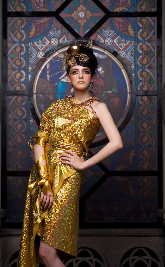 Fathion lady in gold gown in the church