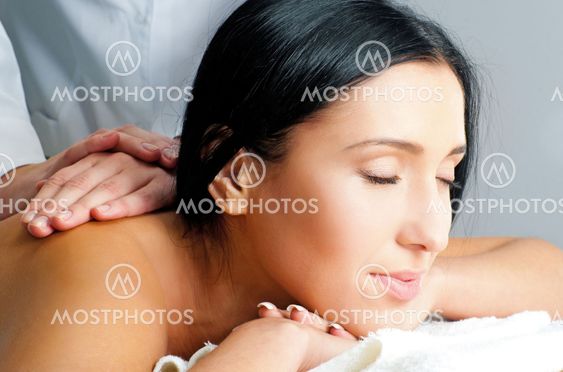 woman receiving facial massage