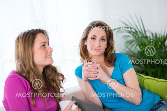 portrait of two beautiful girls at home