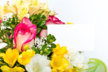 Colorful bouquet featuring roses, lilies, and other...