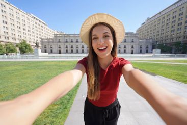 Tourism in Santiago de Chile. Selfie photo of happy...