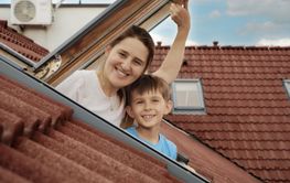 Delight of a mother and her son as they open attic...