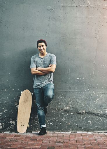 Fashion, skateboard and portrait of man in city with...