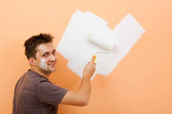 Man painting a wall