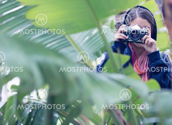 Young brunette taking a picture
