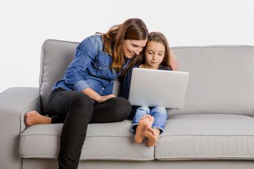 Mother teaching her little daughter