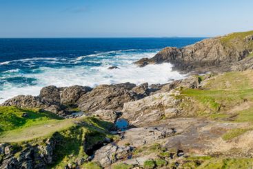 Rough and rocky shore at Malin Head, Ireland's...