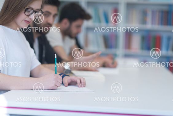 group of students study together in classroom