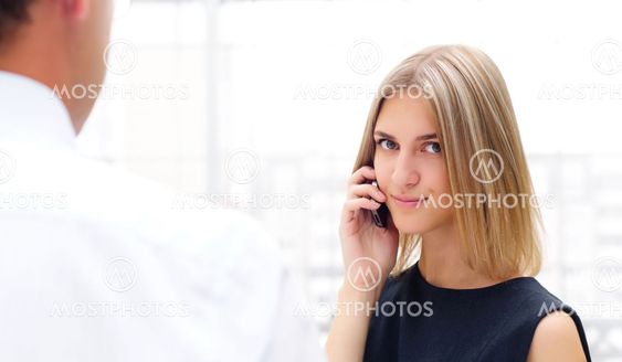 business man and business woman discuss reports