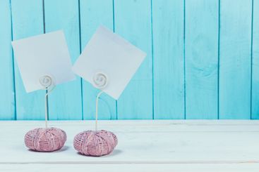 Cute home decor card holders on blue wooden background