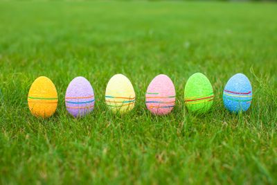 Colored colorful easter eggs in the grass