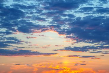 vibrant sky after sunset, with deep orange and pink hues...