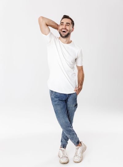 Full length of a handsome cheerful man