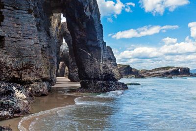 Natural arches on beach.